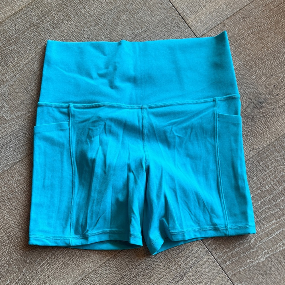 Athleta Turquoise Salutation stash 5” Bike Shorts with Pockets NWOT S